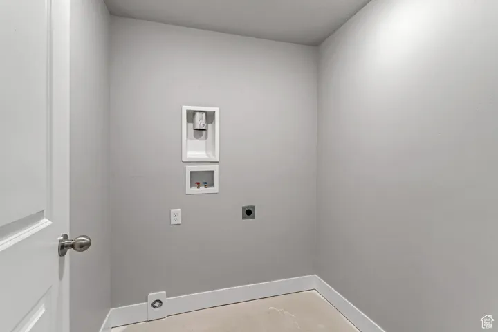 Washroom featuring electric dryer hookup and hookup for a washing machine