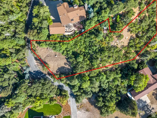 Aerial view of property and surrounding area with property boundaries highlighted