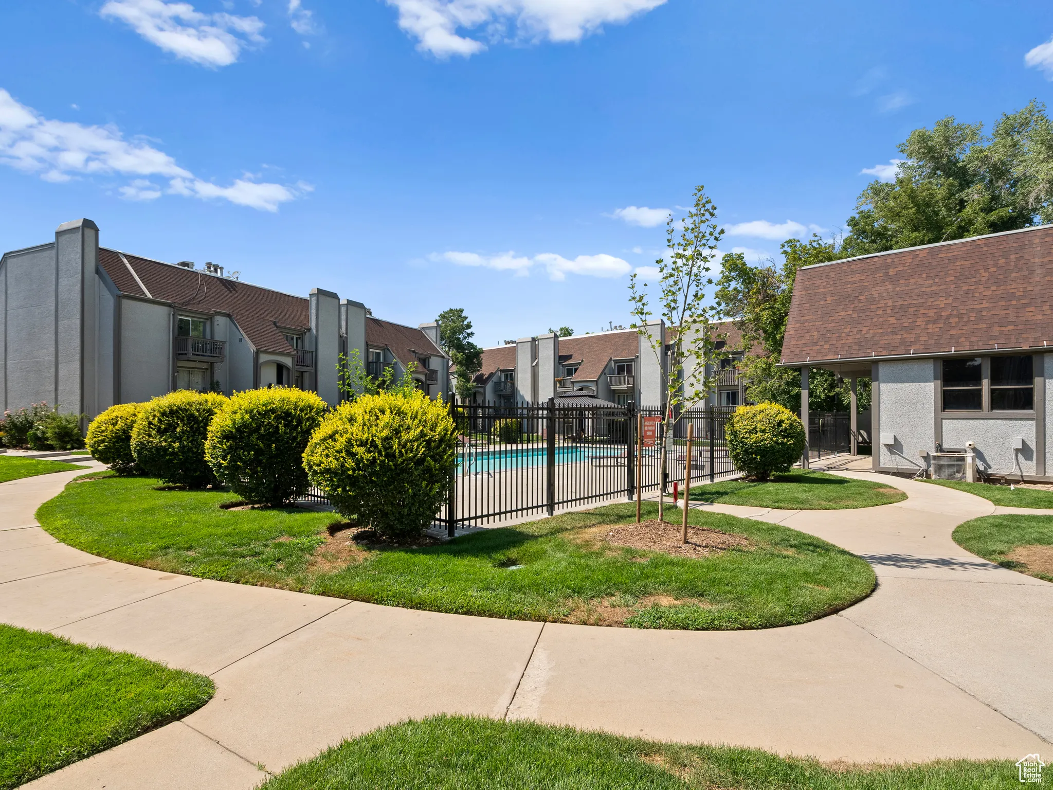 View of home's community featuring a residential view and a swimming pool