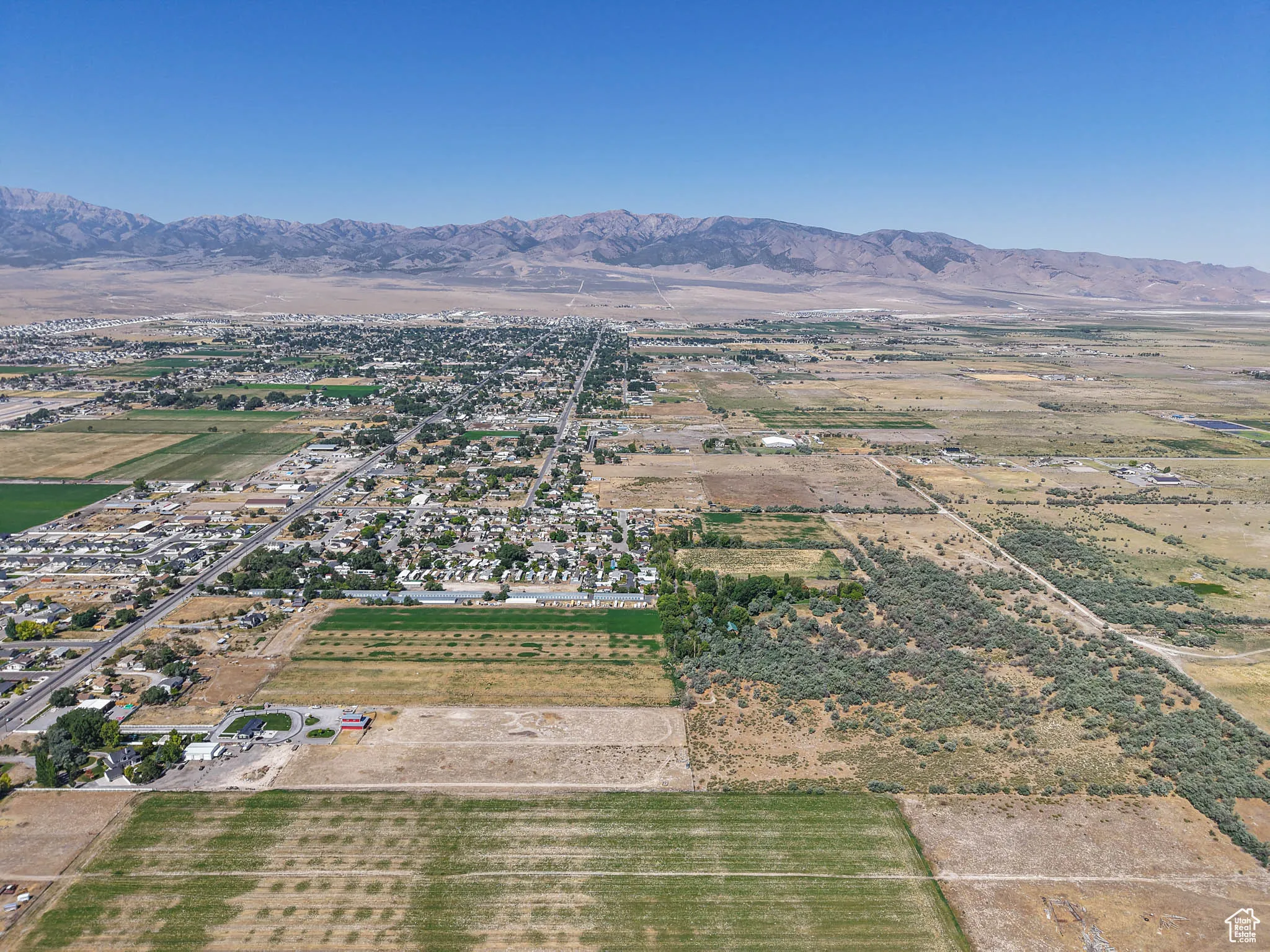 Aerial overview of property's location featuring rural landscape and mountains