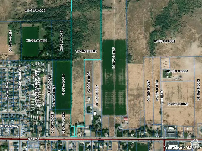 Aerial overview of property's location with property parcel outlined