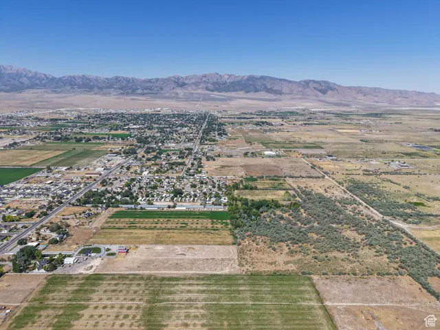 Aerial overview of property's location featuring rural landscape and mountains