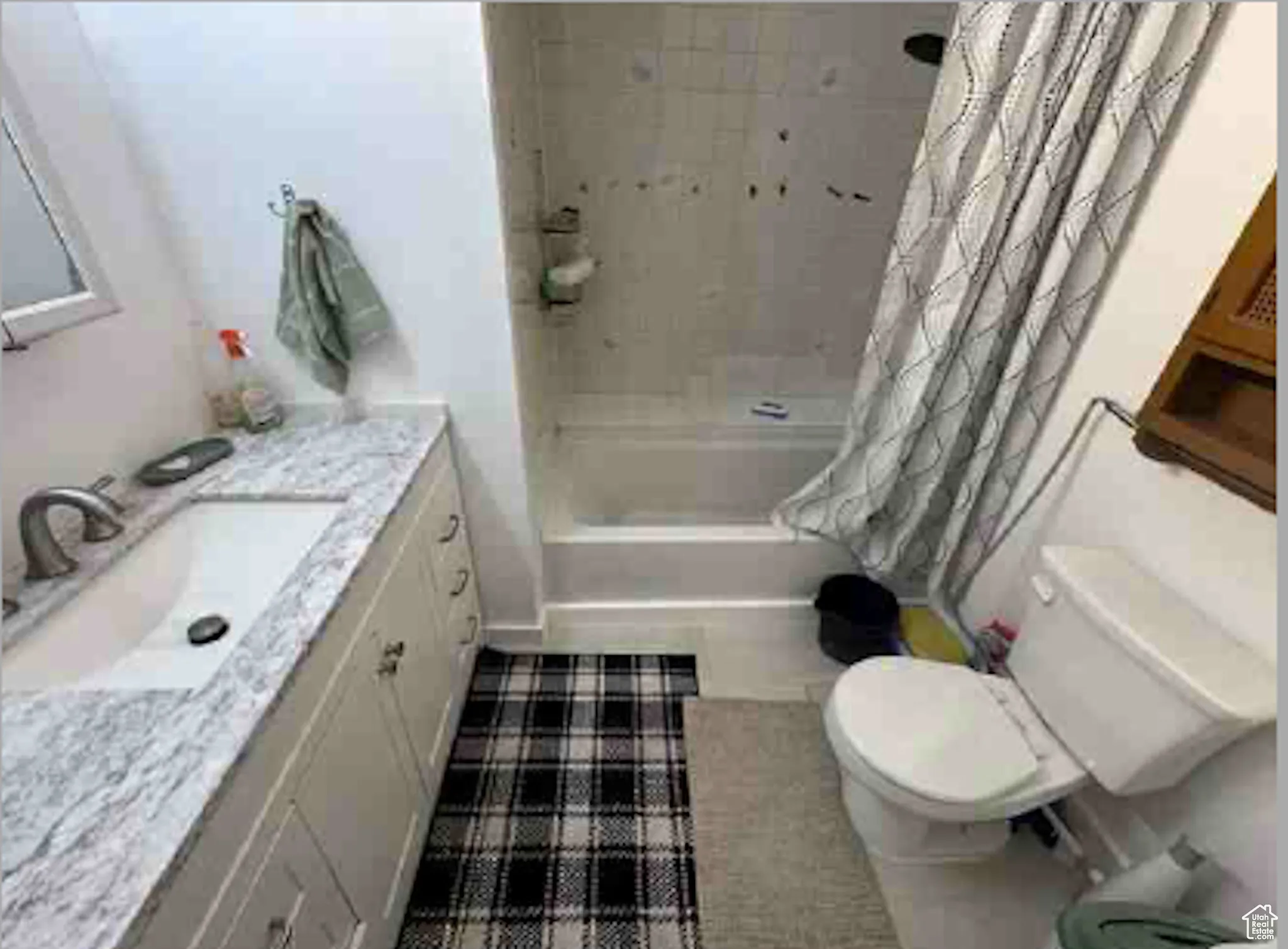 Full bathroom featuring vanity and shower / tub combo