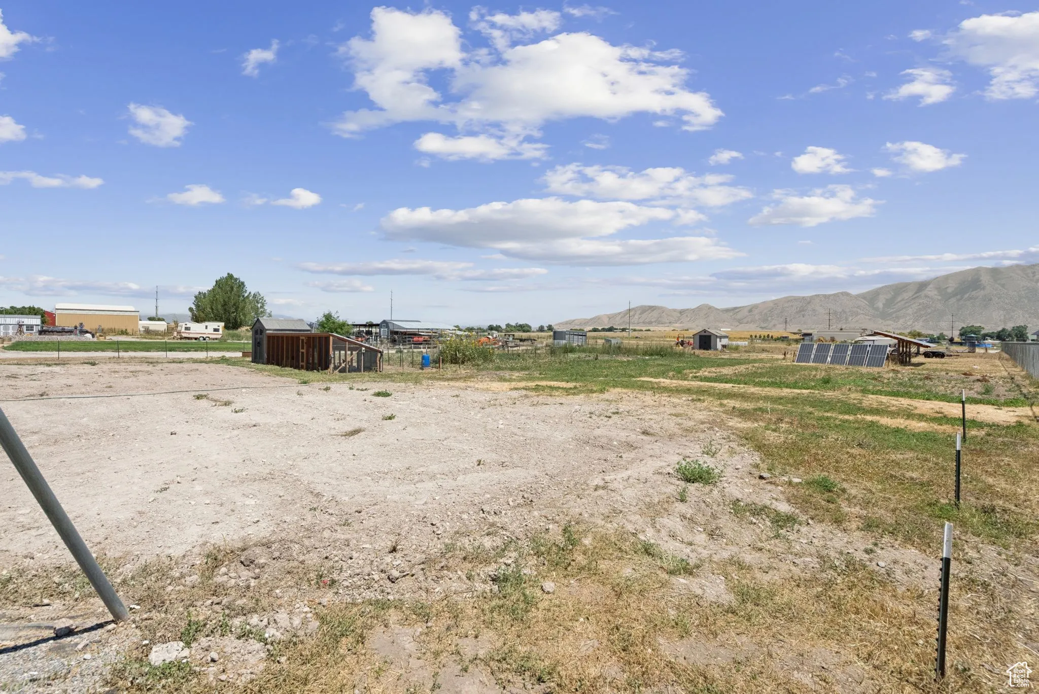View of yard with a mountain view and an outbuilding