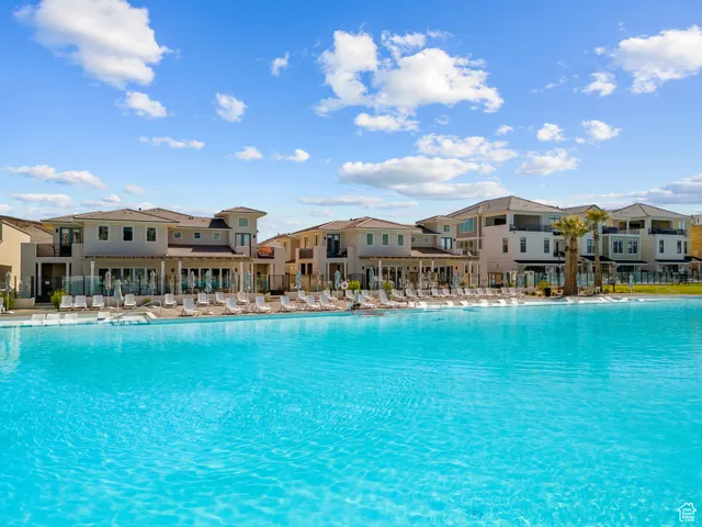 Community pool featuring a residential view and a patio area