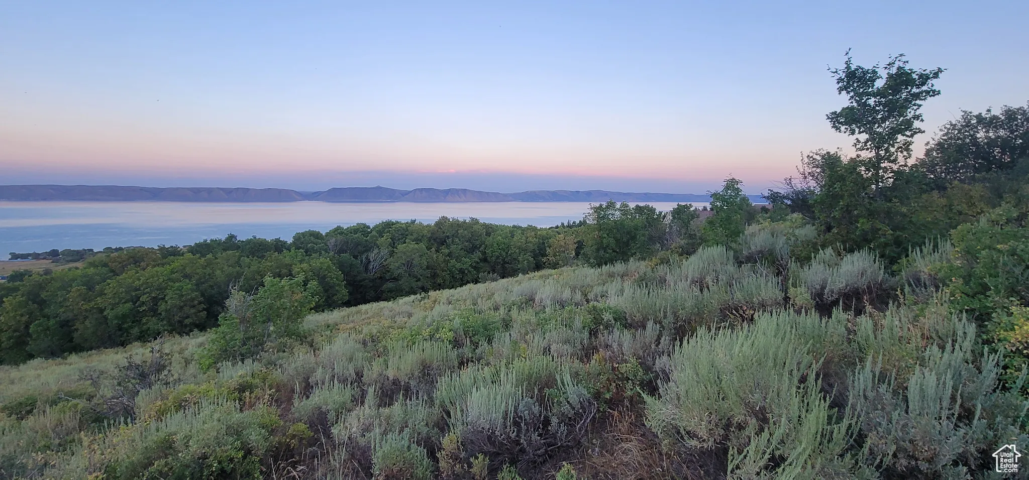 View of undeveloped land featuring a nearby body of water