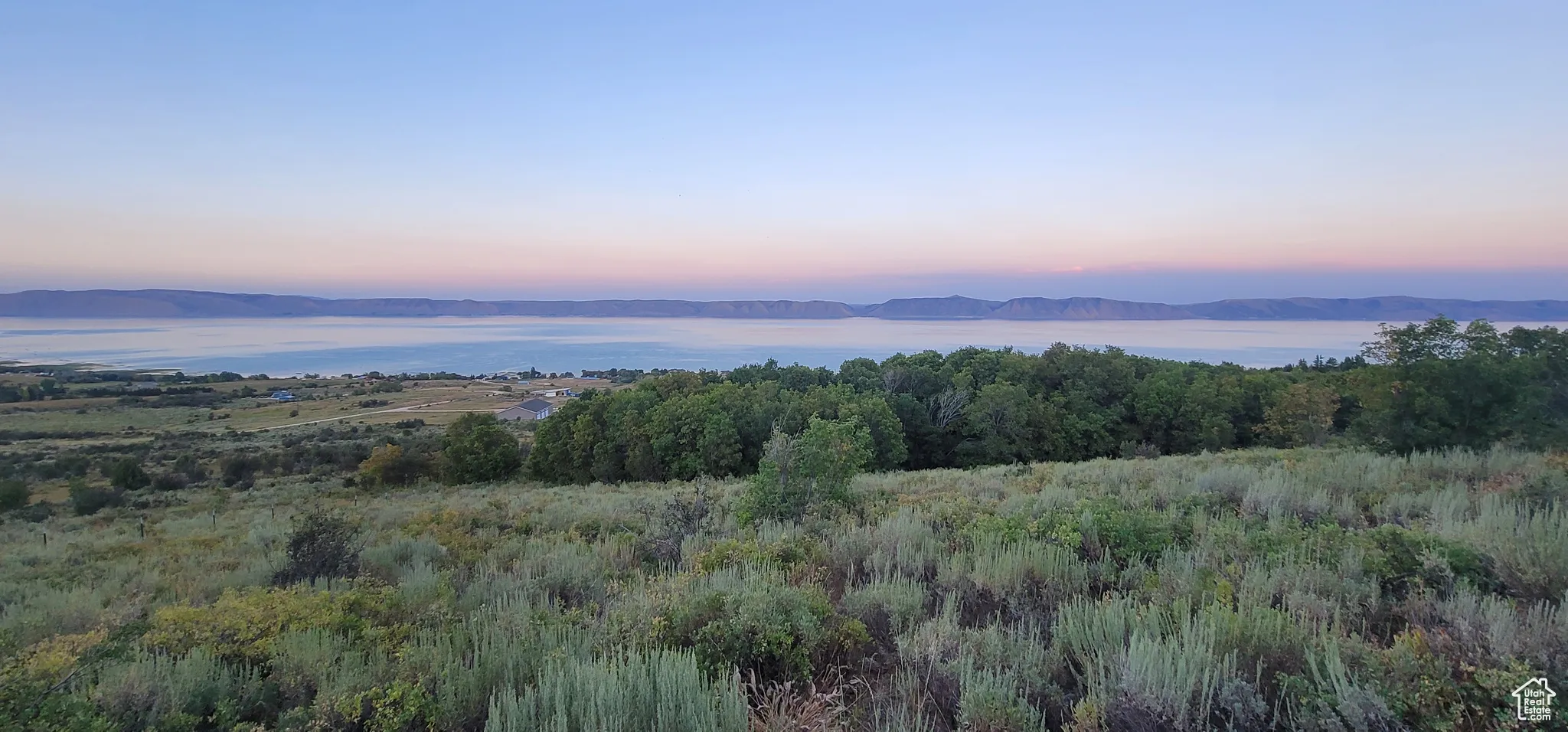 Mountain view featuring a nearby body of water