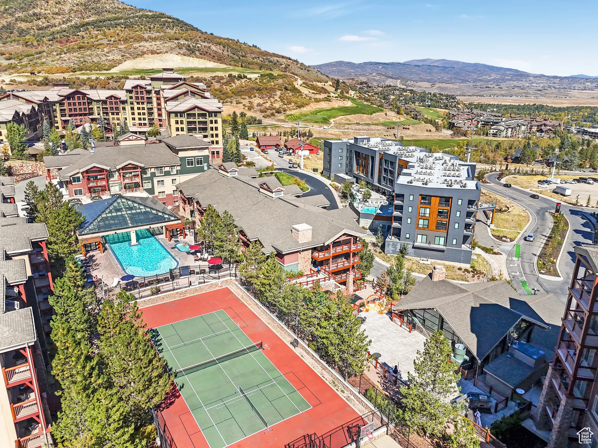 Aerial view of a mountainous background and a pool area