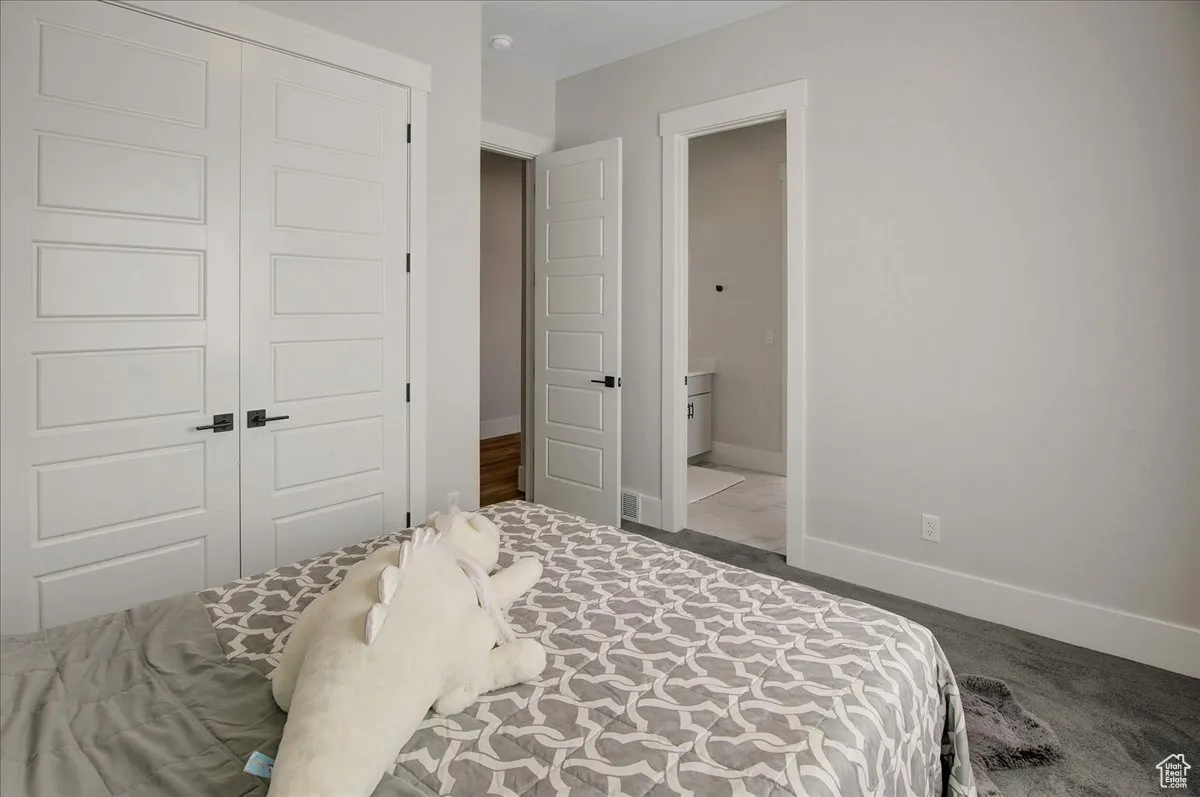 Bedroom with baseboards and a closet
