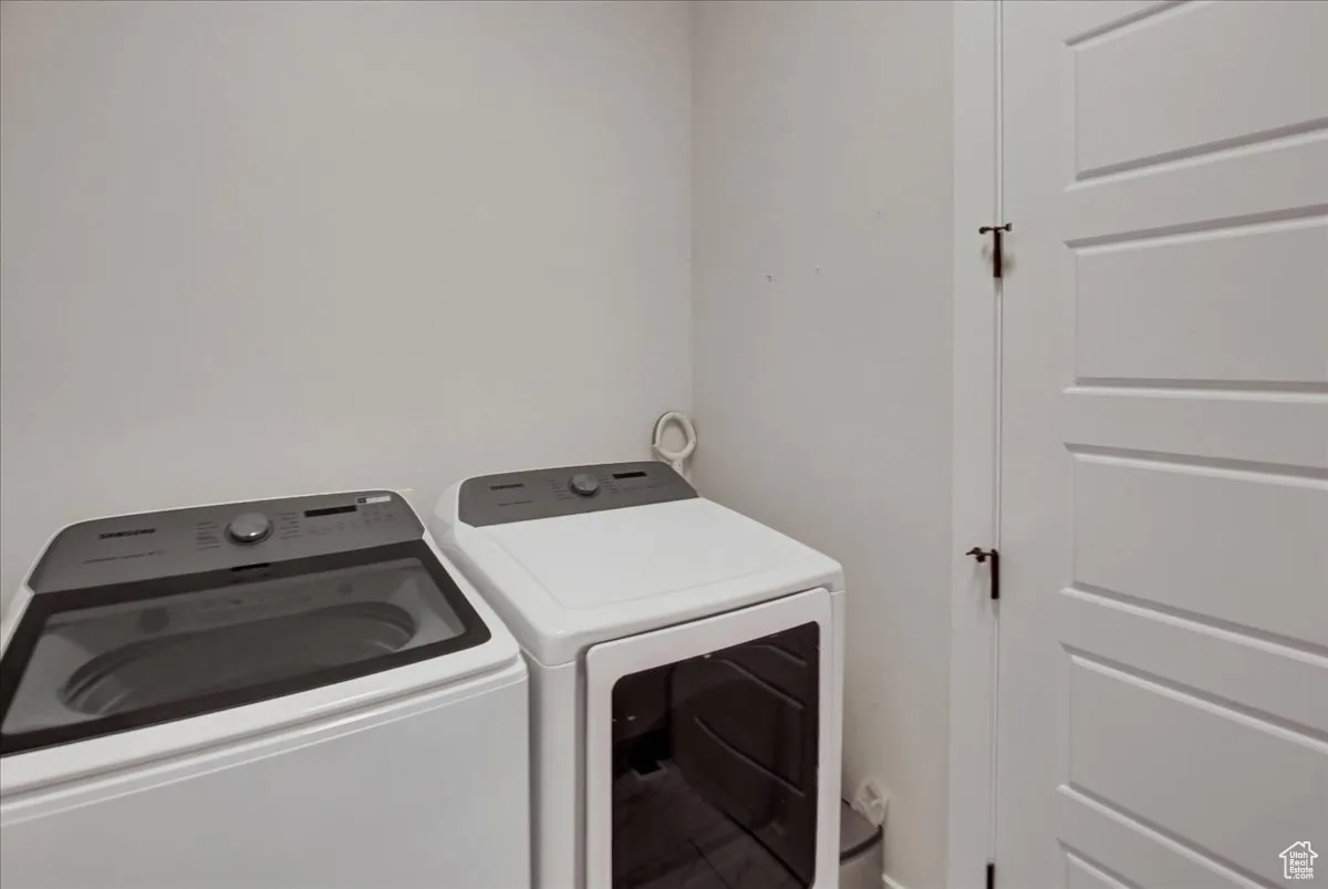 Laundry room featuring washing machine and clothes dryer