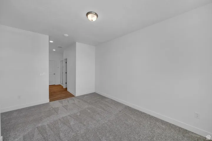 Spare room with carpet flooring and recessed lighting