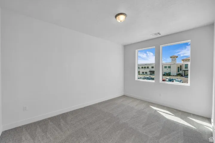 Empty room featuring carpet
