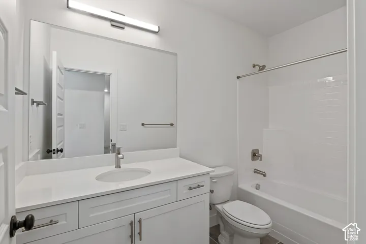 Bathroom with vanity and shower / bath combination