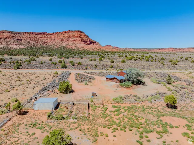 View of mountain backdrop with a desert landscape and rural landscape