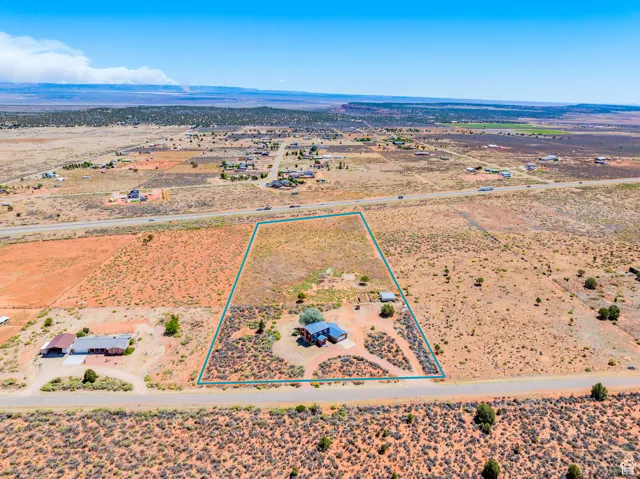 Overview of rural landscape with property boundaries highlighted and a desert landscape