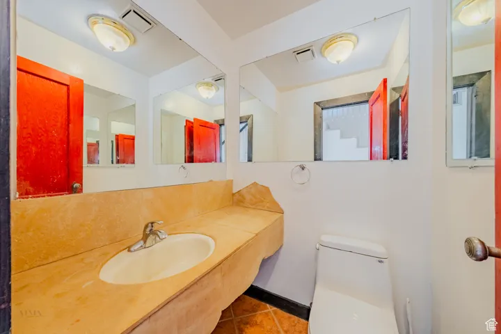 Bathroom with vanity and tile patterned floors
