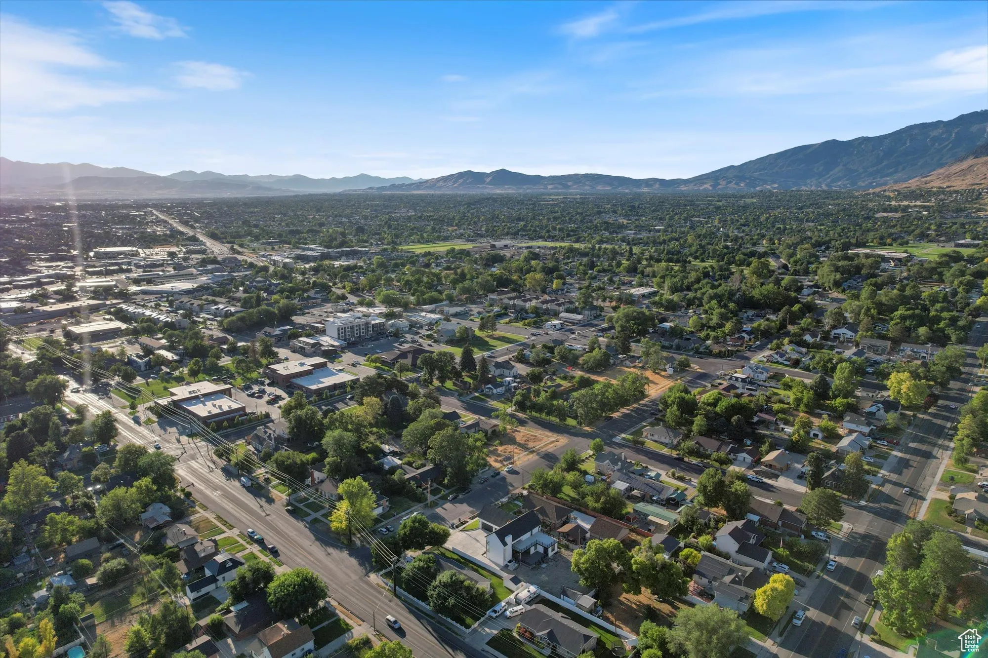 View of property location featuring a mountainous background and nearby suburban area