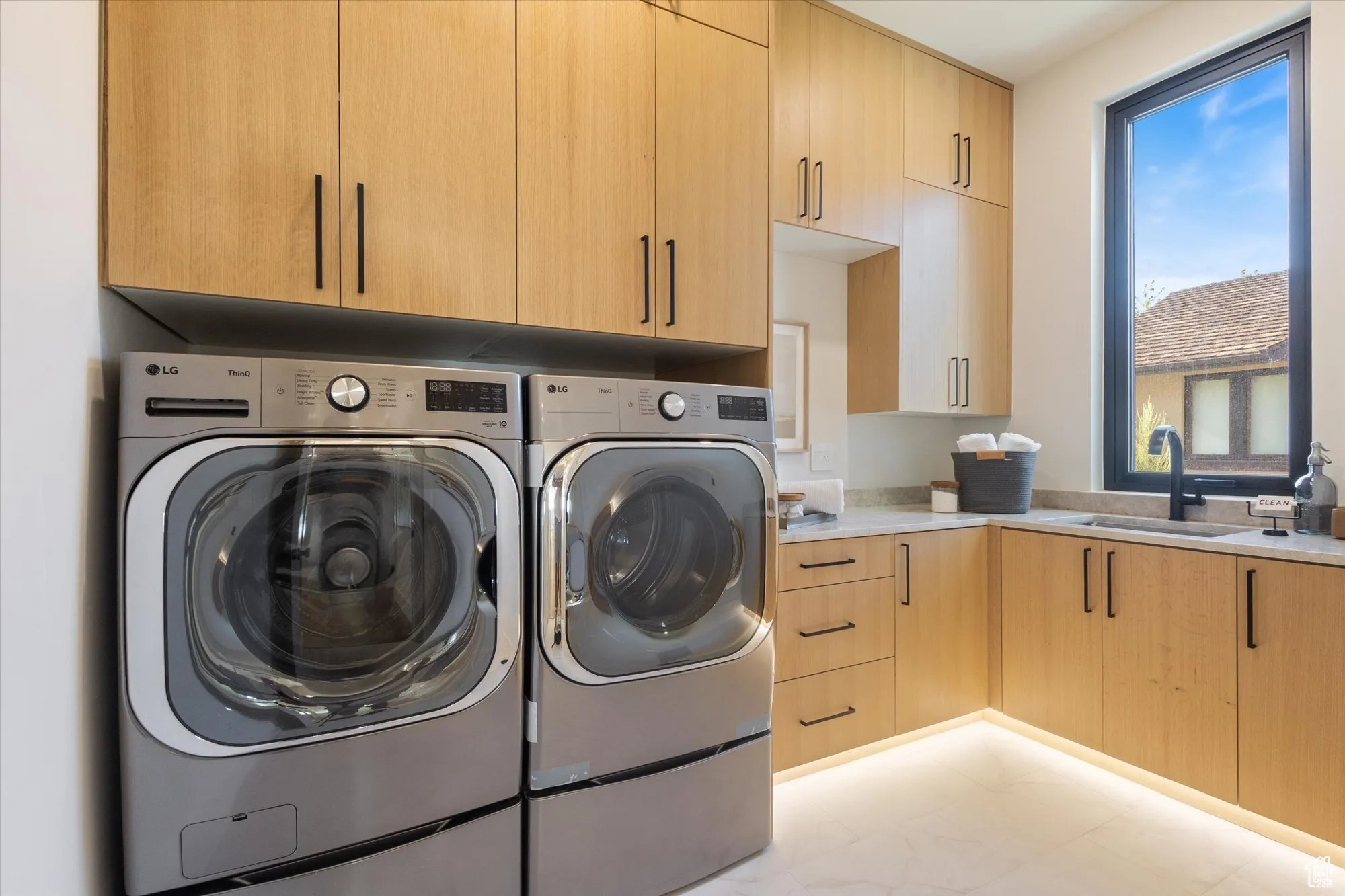 Laundry room with washer and dryer and cabinet space