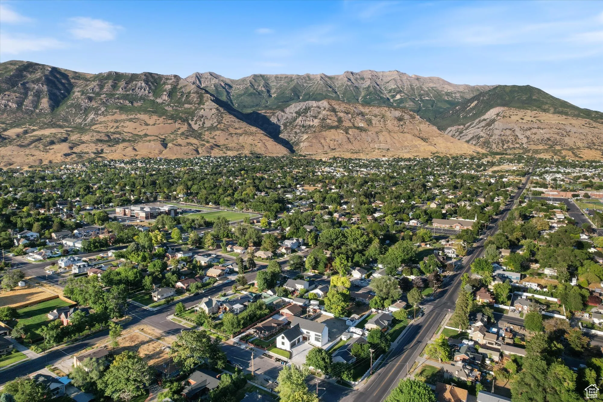 View of property location featuring nearby suburban area and a mountainous background