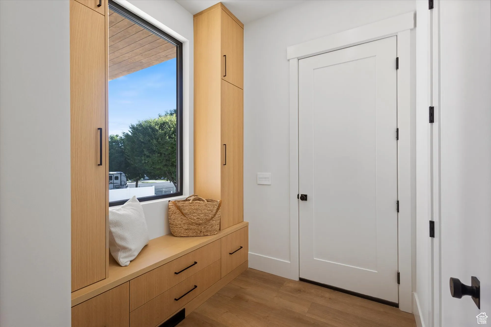 Mudroom with light wood finished floors
