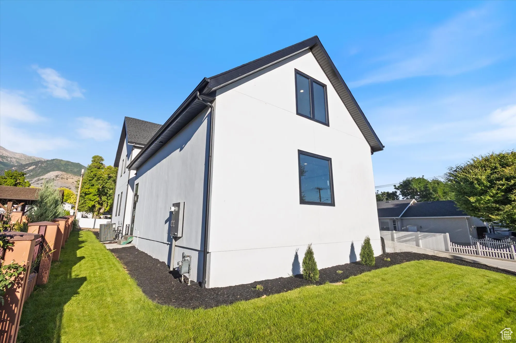 View of home's exterior with stucco siding and a mountain view