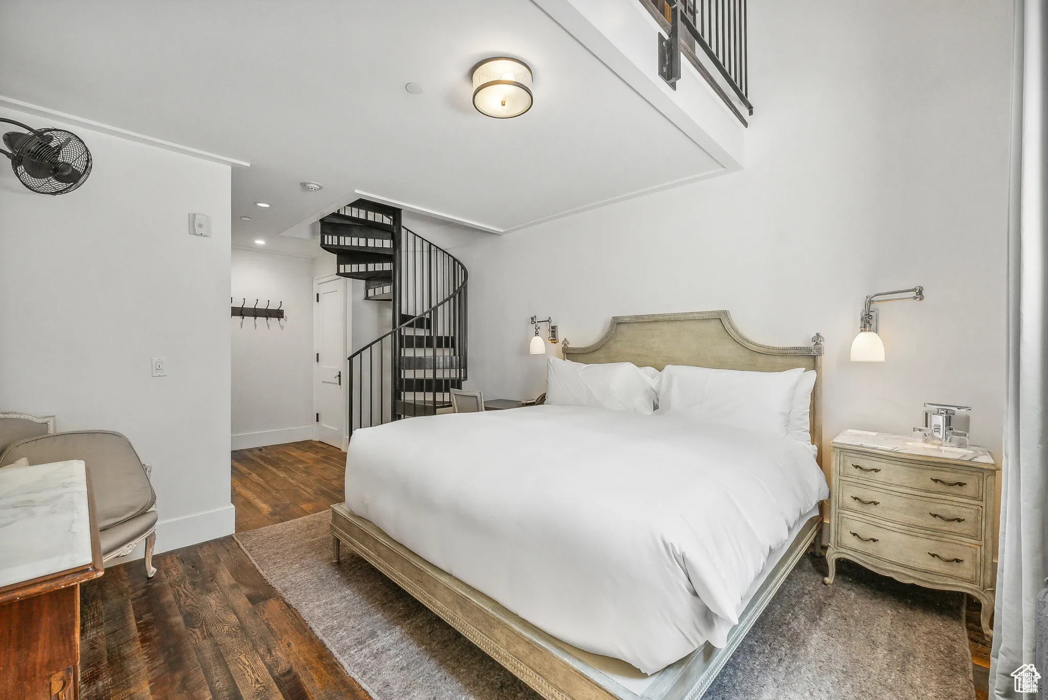 Bedroom with wood finished floors and recessed lighting