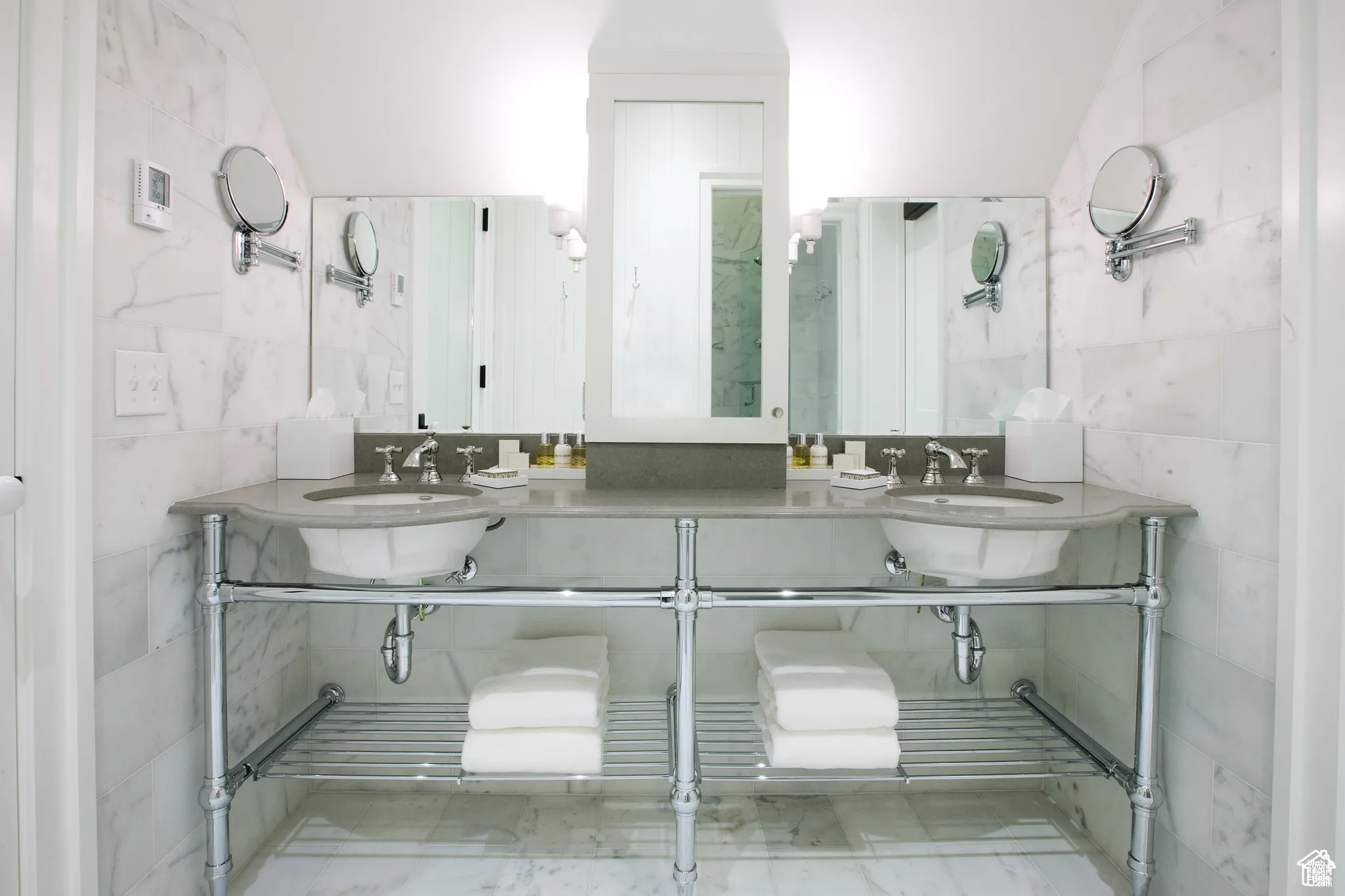 Full bathroom featuring tile walls
