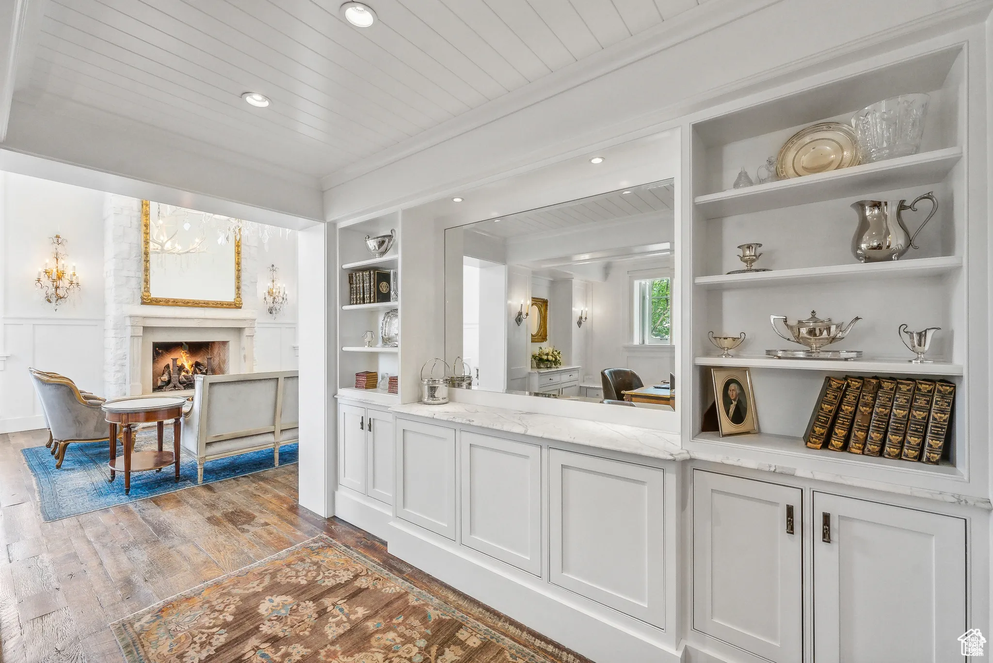 Bar area with built in features, hardwood / wood-style flooring, recessed lighting, wood ceiling, and a warm lit fireplace