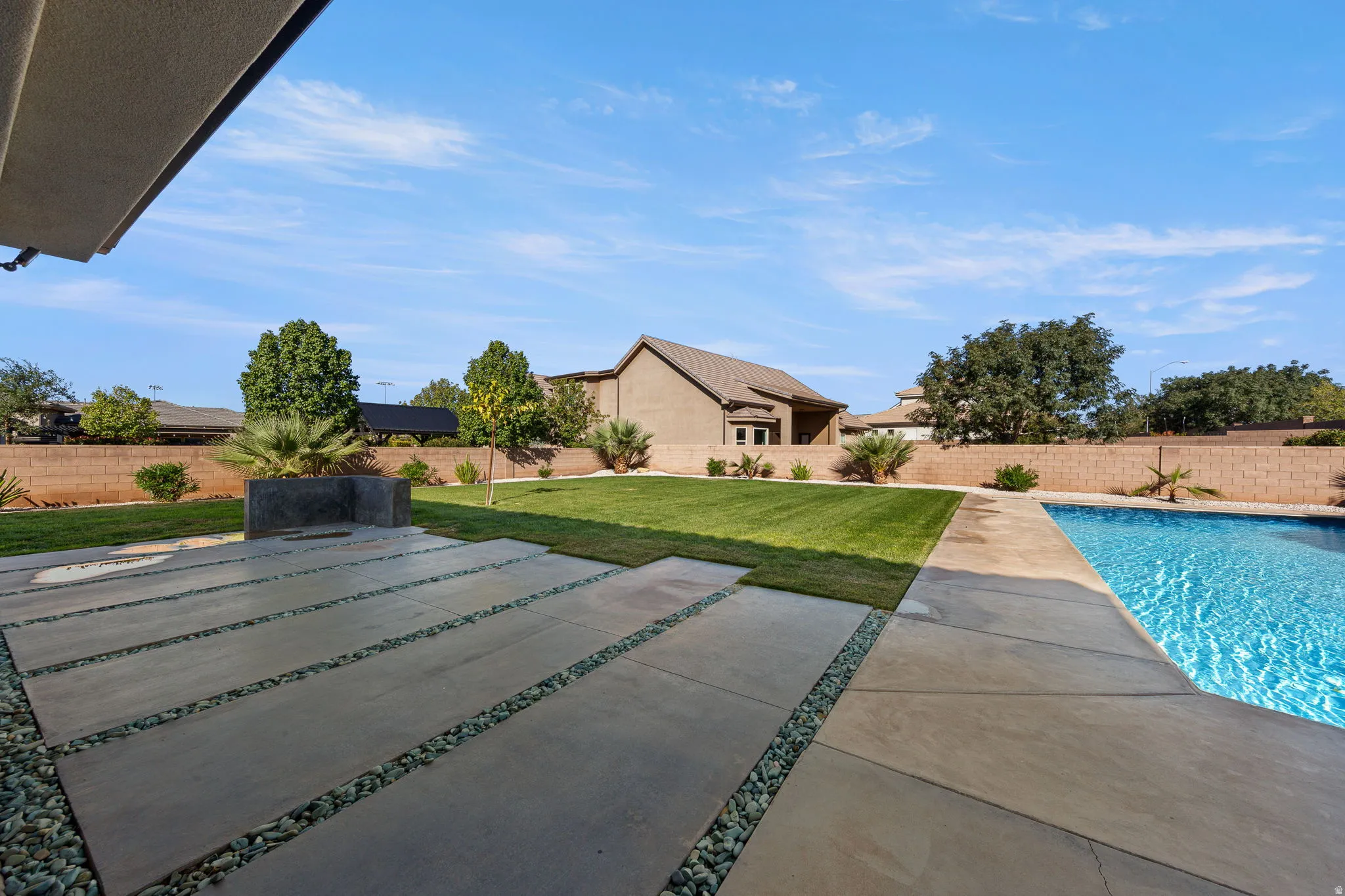 View of pool with a fenced backyard and a patio area