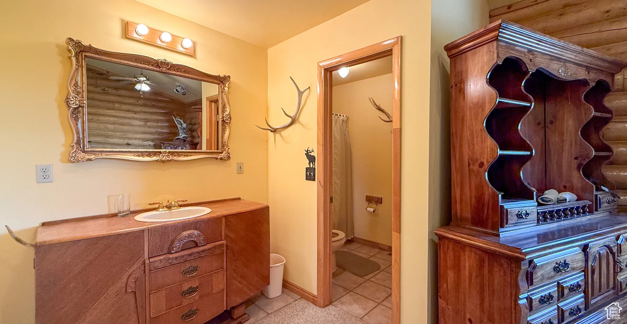 Bathroom with vanity and tile patterned flooring