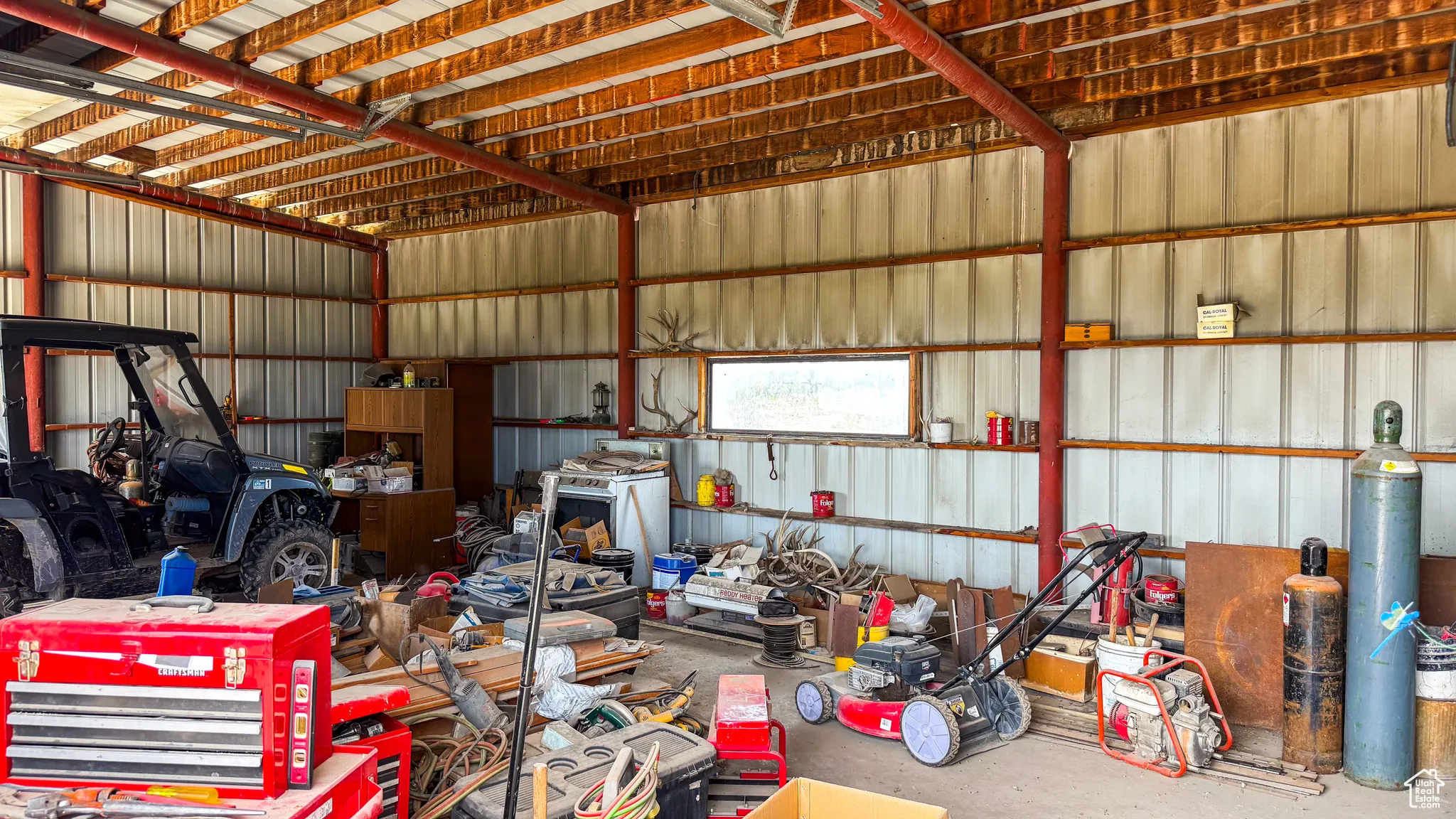 Garage featuring metal wall