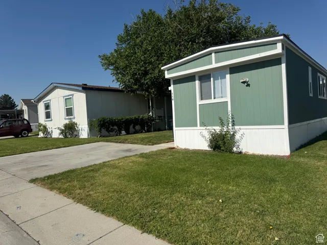 View of home's exterior featuring a yard