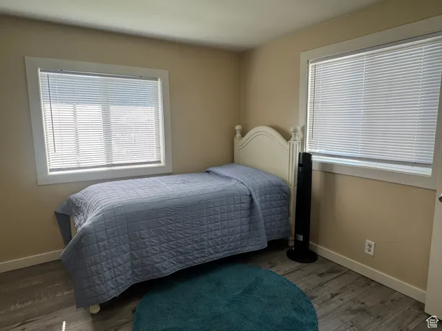 Bedroom with wood finished floors