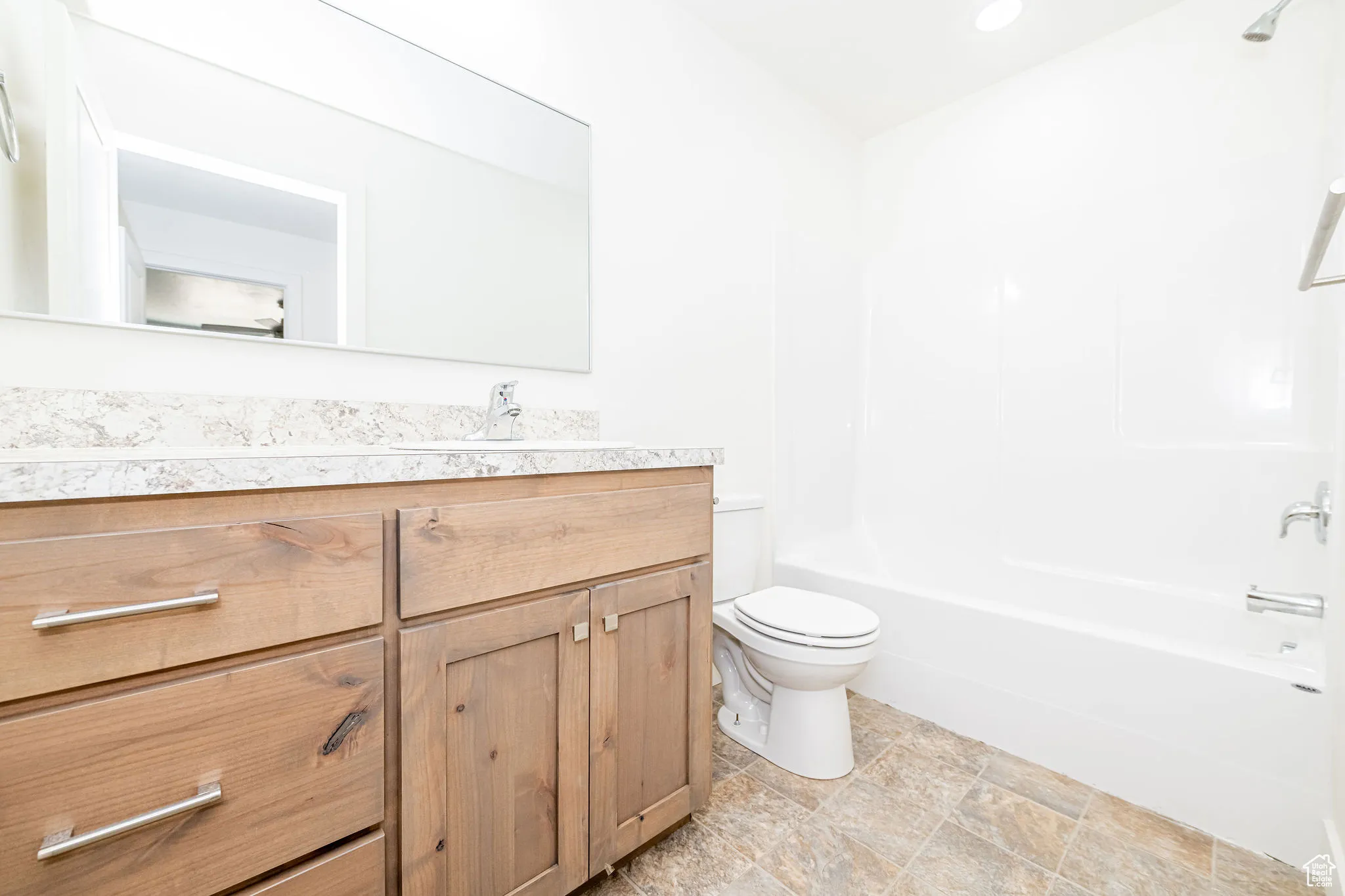 Full bathroom with vanity and washtub / shower combination