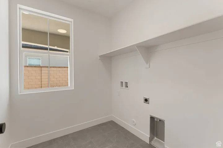 Laundry area featuring hookup for a washing machine, hookup for an electric dryer, and hookup for a gas dryer