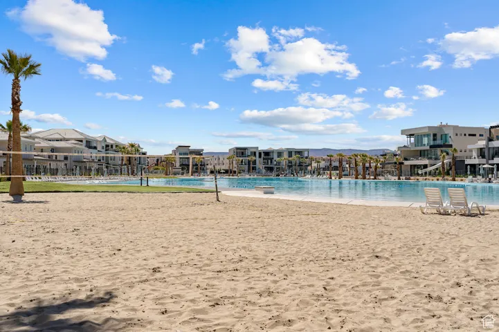 View of swimming pool featuring a residential view and volleyball court