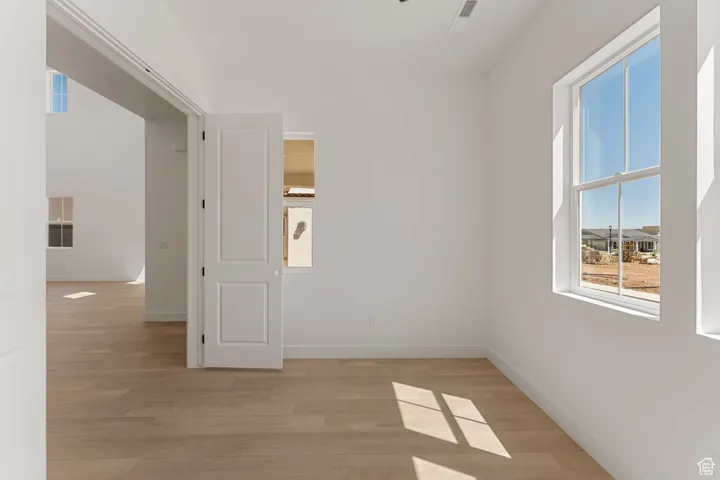 Empty room featuring light wood-style floors and baseboards