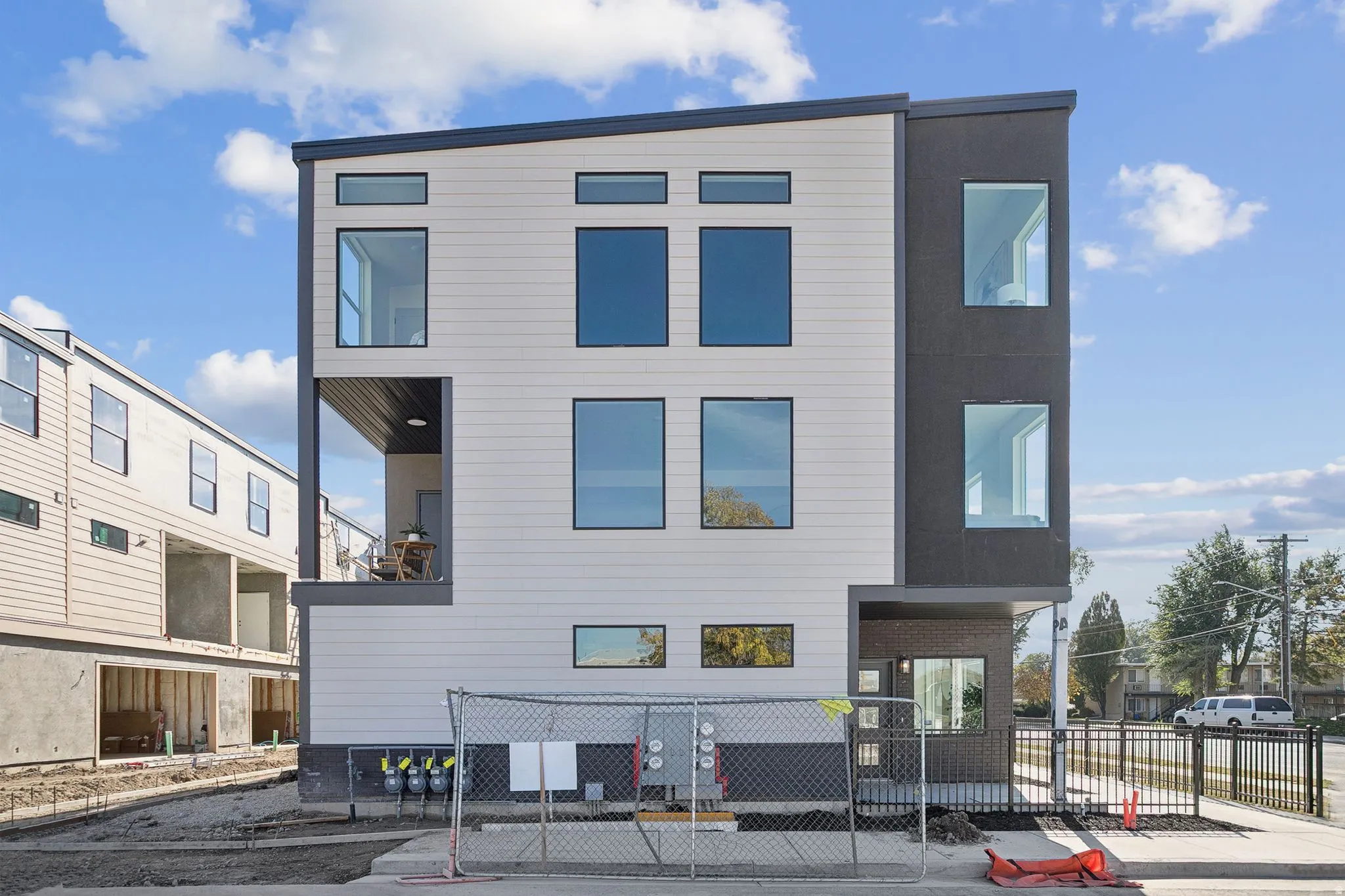 View of building exterior with a fenced front yard