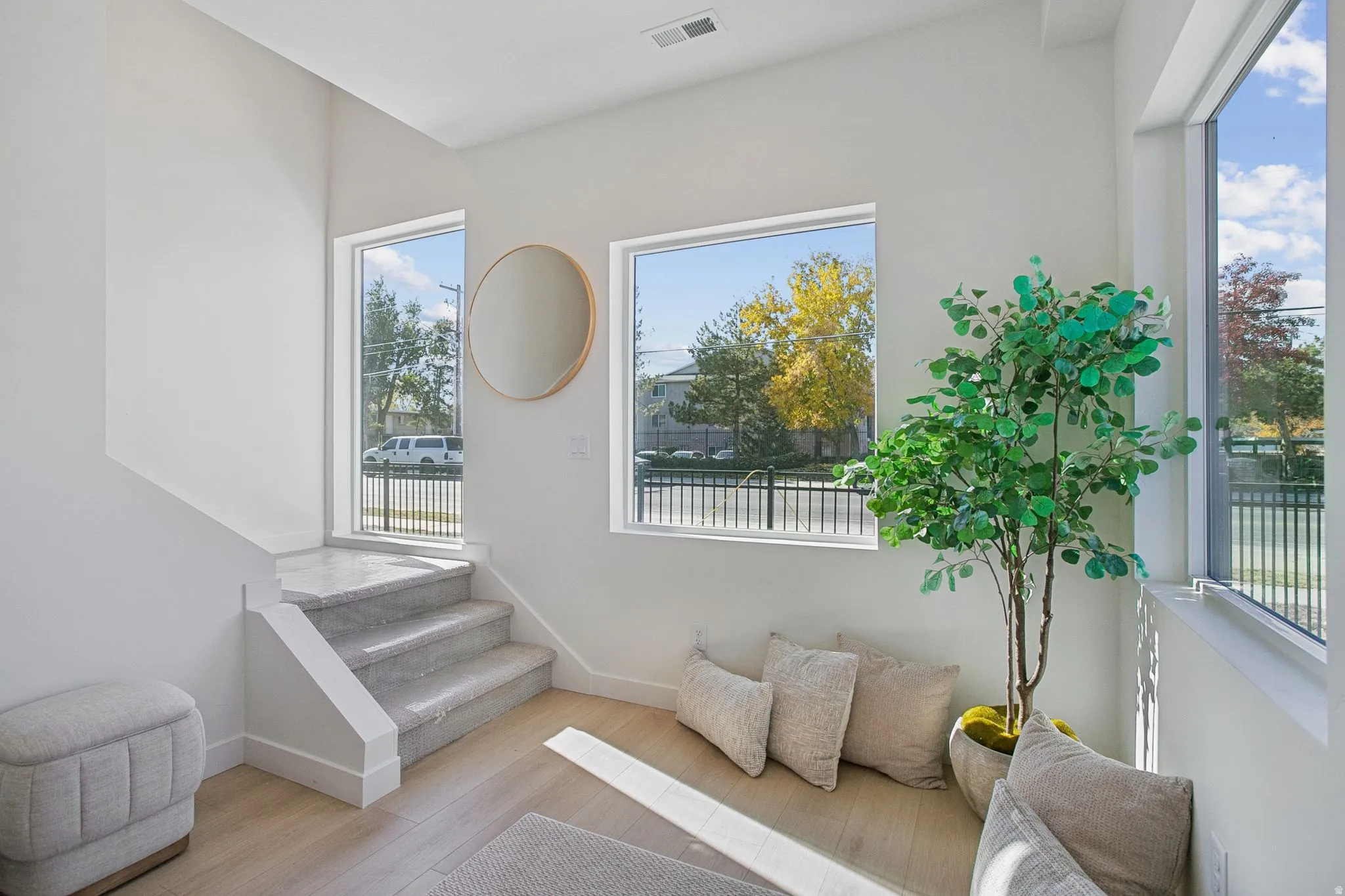 Sitting room featuring wood finished floors and plenty of natural light