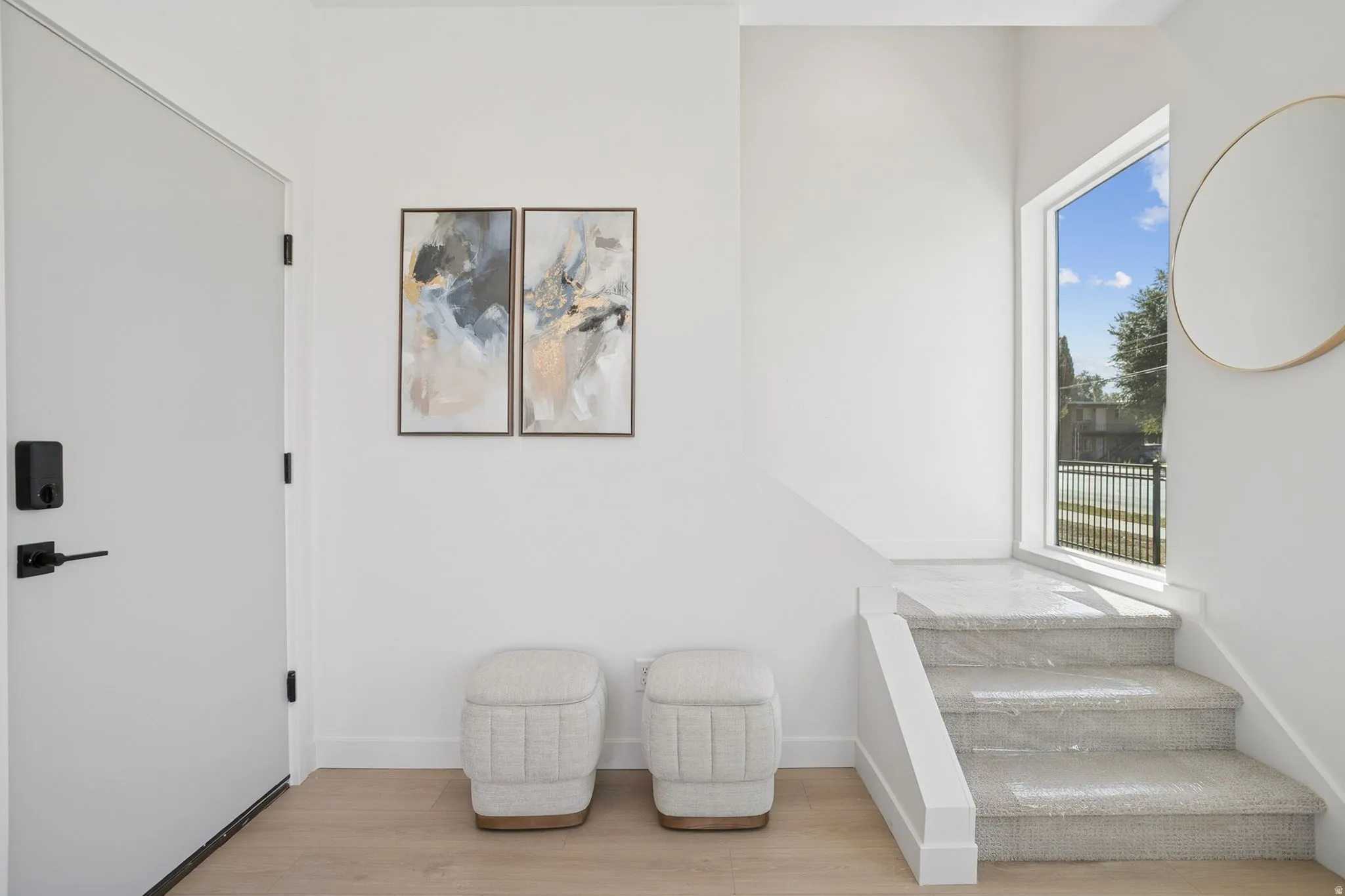 Sitting room featuring light wood-type flooring and baseboards
