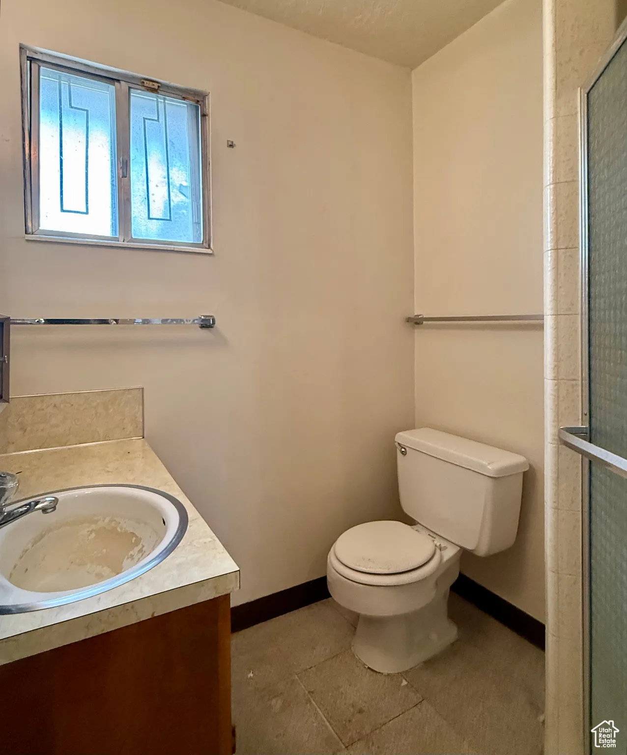 Full bathroom with vanity and tiled shower
