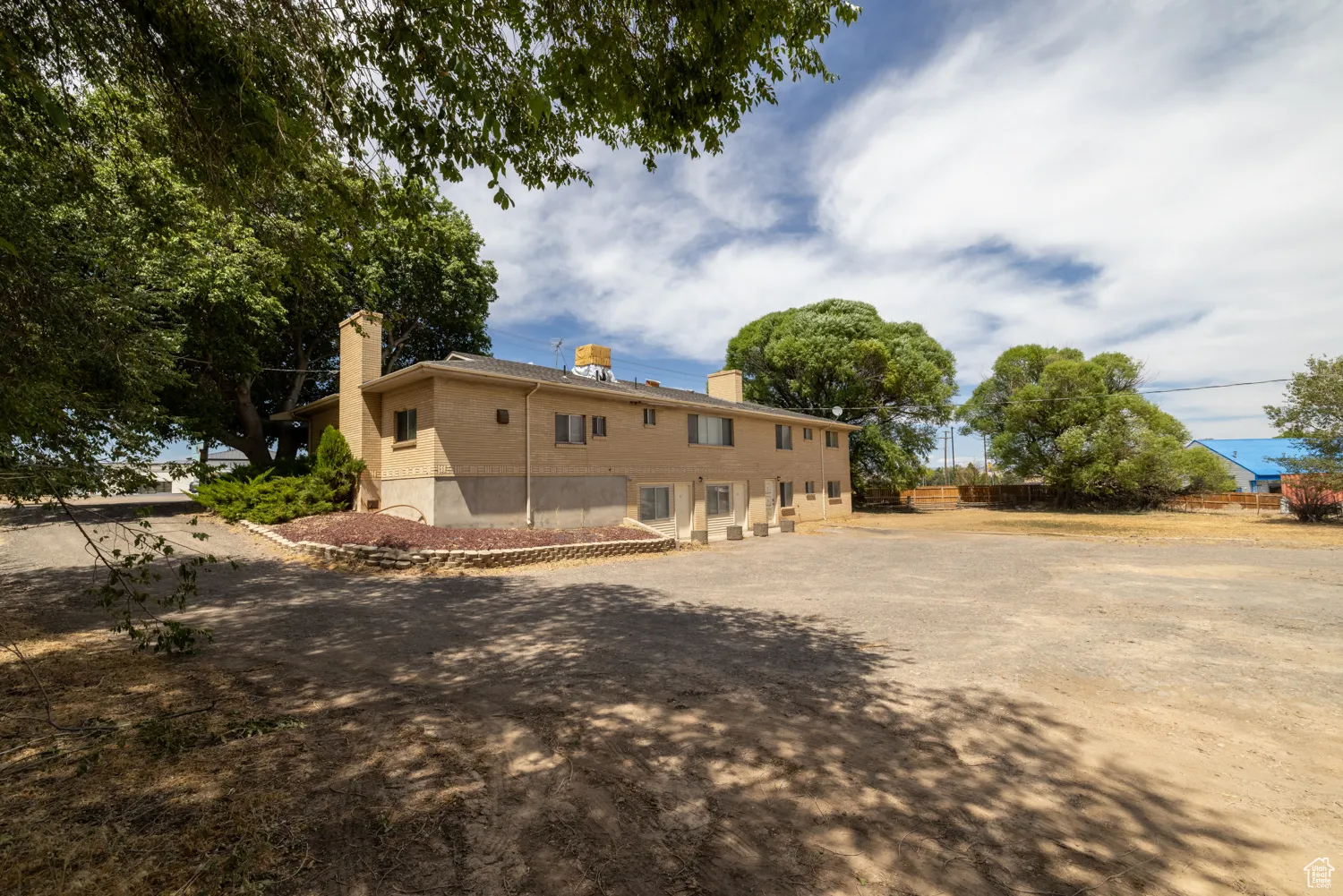 View of side of home with a chimney
