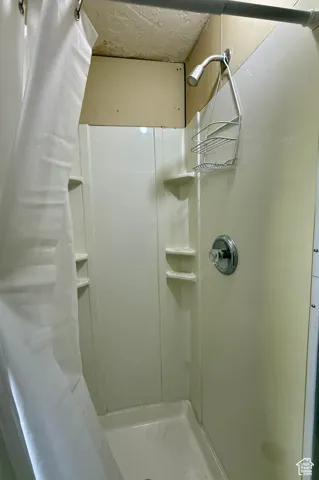 Full bath featuring a stall shower