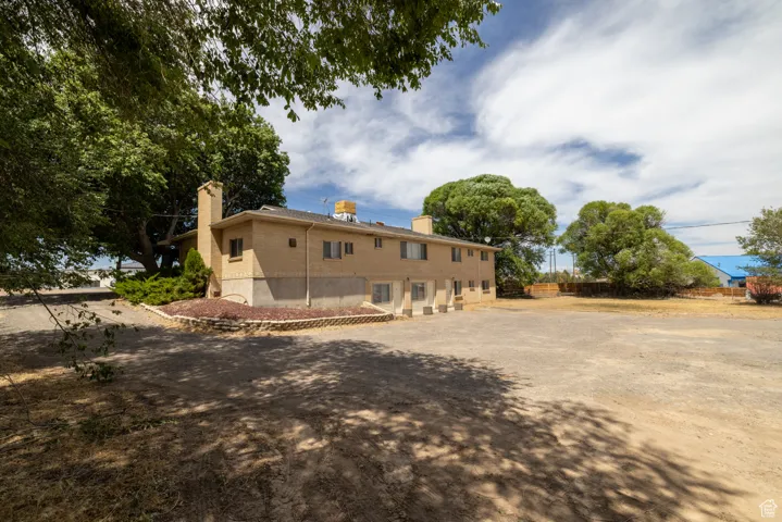 View of side of home with a chimney