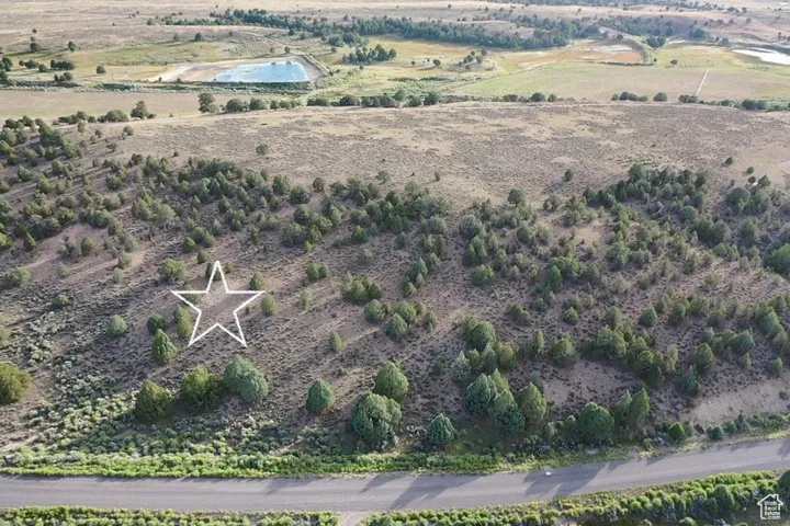Aerial view of property and surrounding area featuring rural landscape