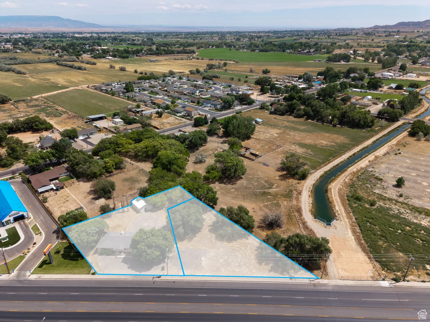 Aerial overview of property's location with property boundaries highlighted and property next door