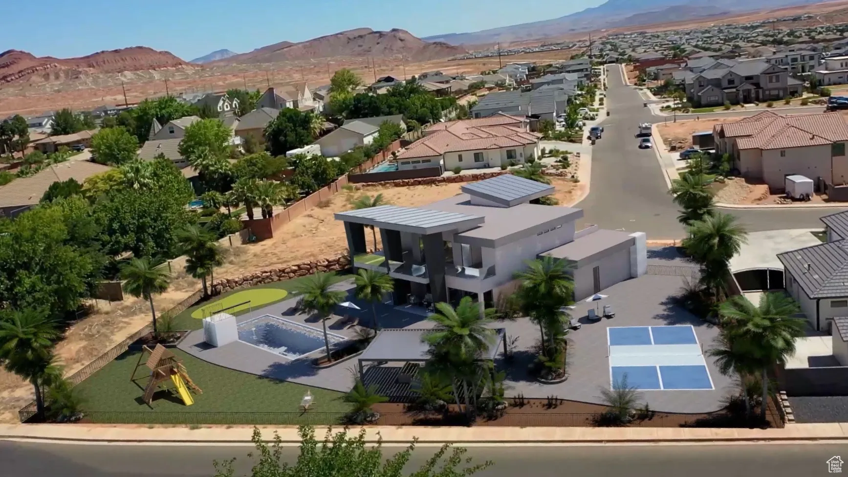 Aerial perspective of suburban area featuring a mountainous background