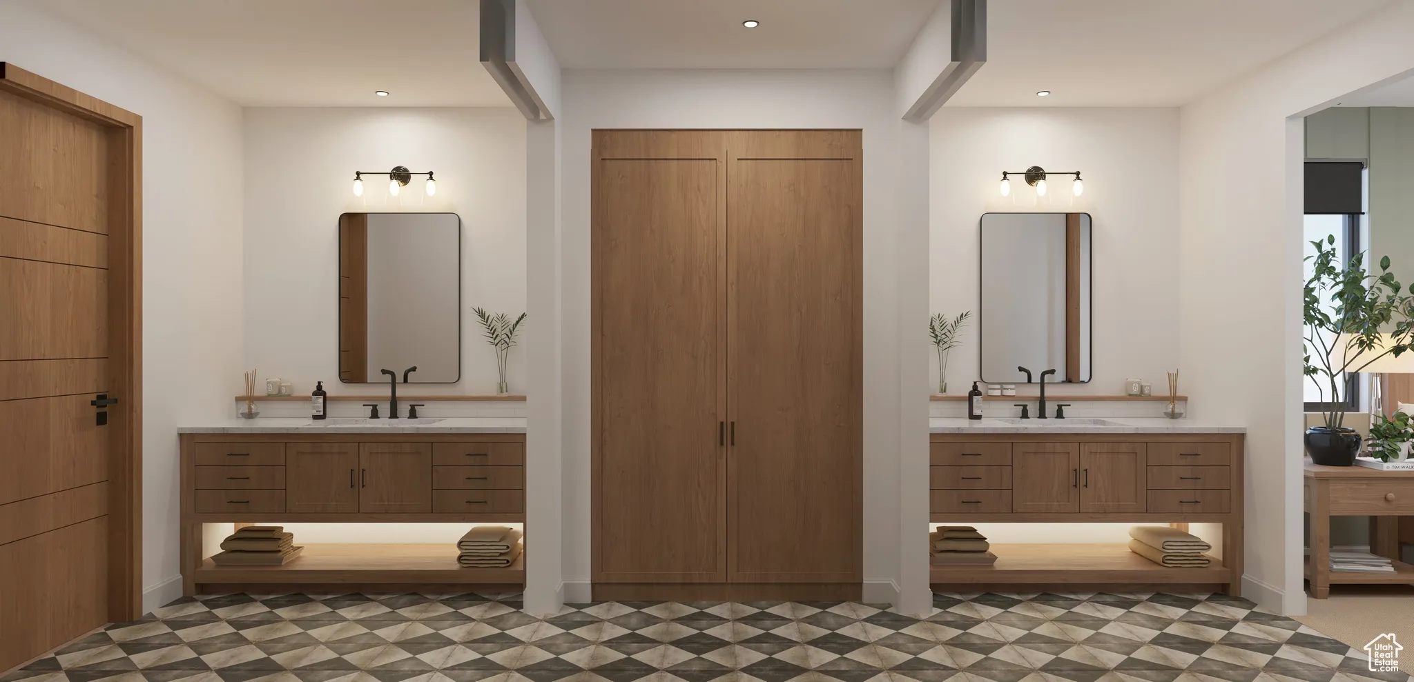 Full bath featuring two vanities, recessed lighting, and a closet