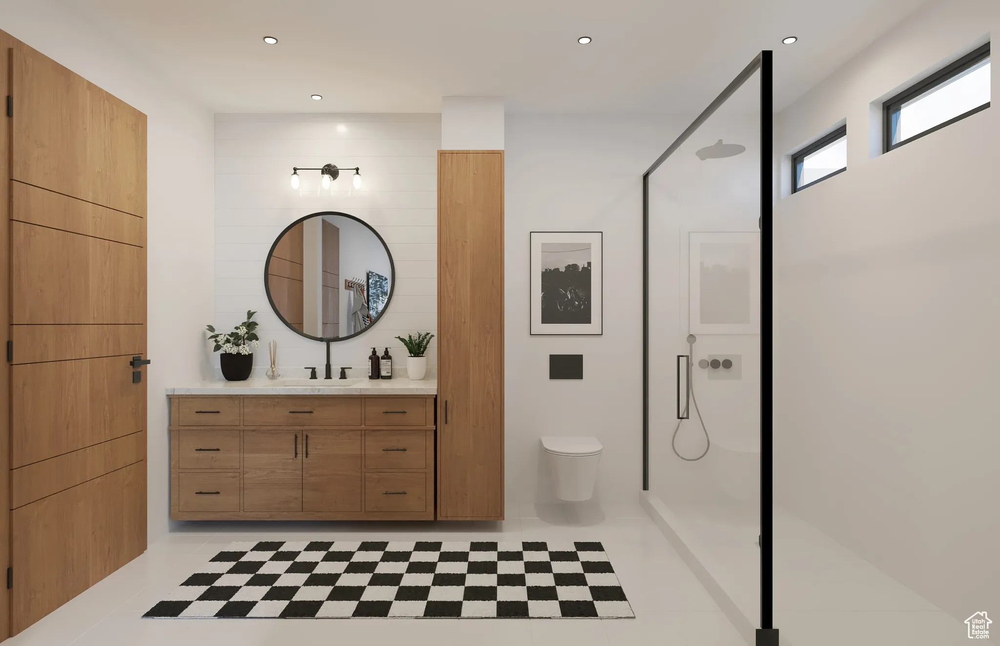 Bathroom featuring vanity, a walk in shower, and recessed lighting