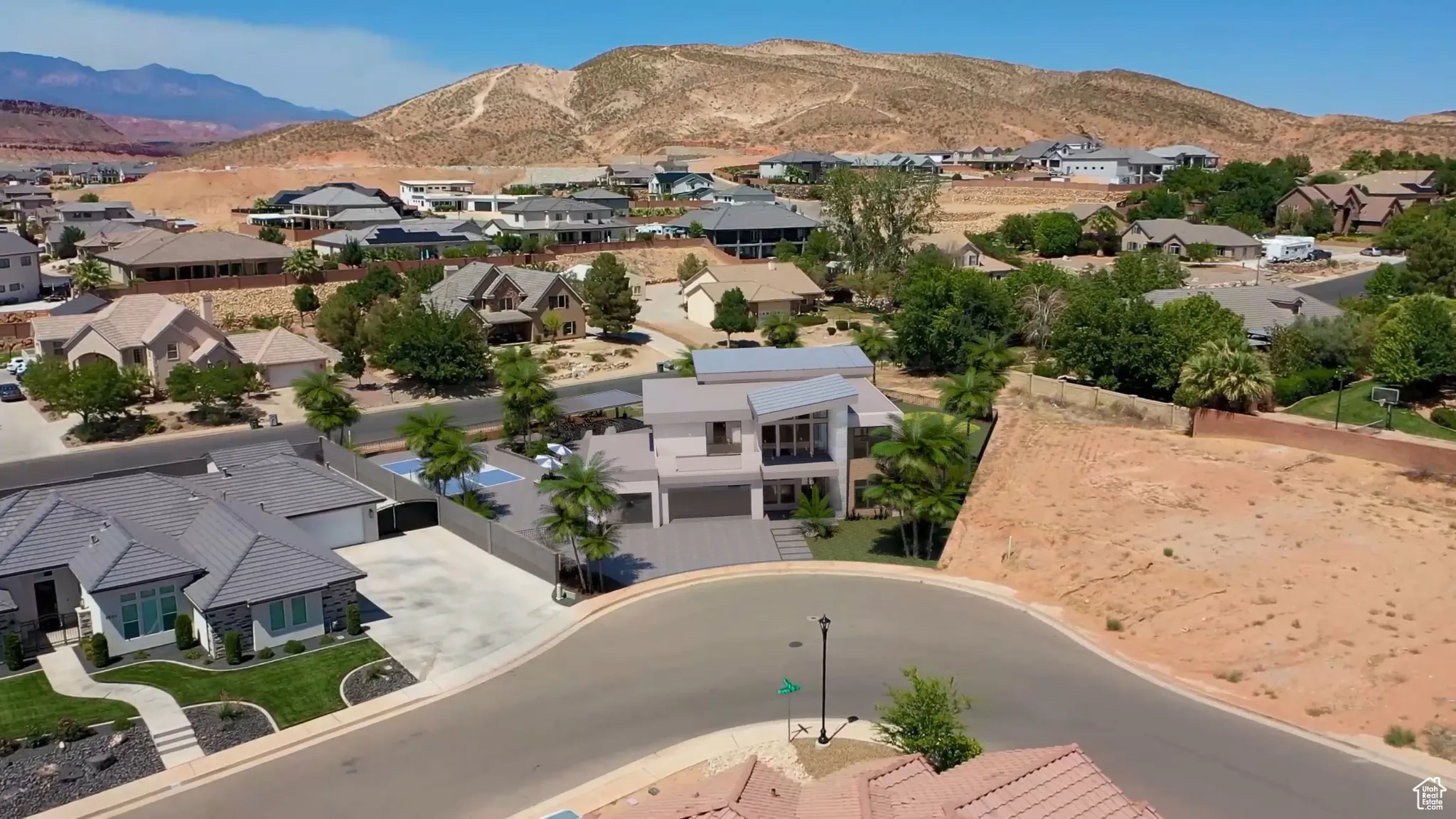 Aerial view of residential area featuring mountains